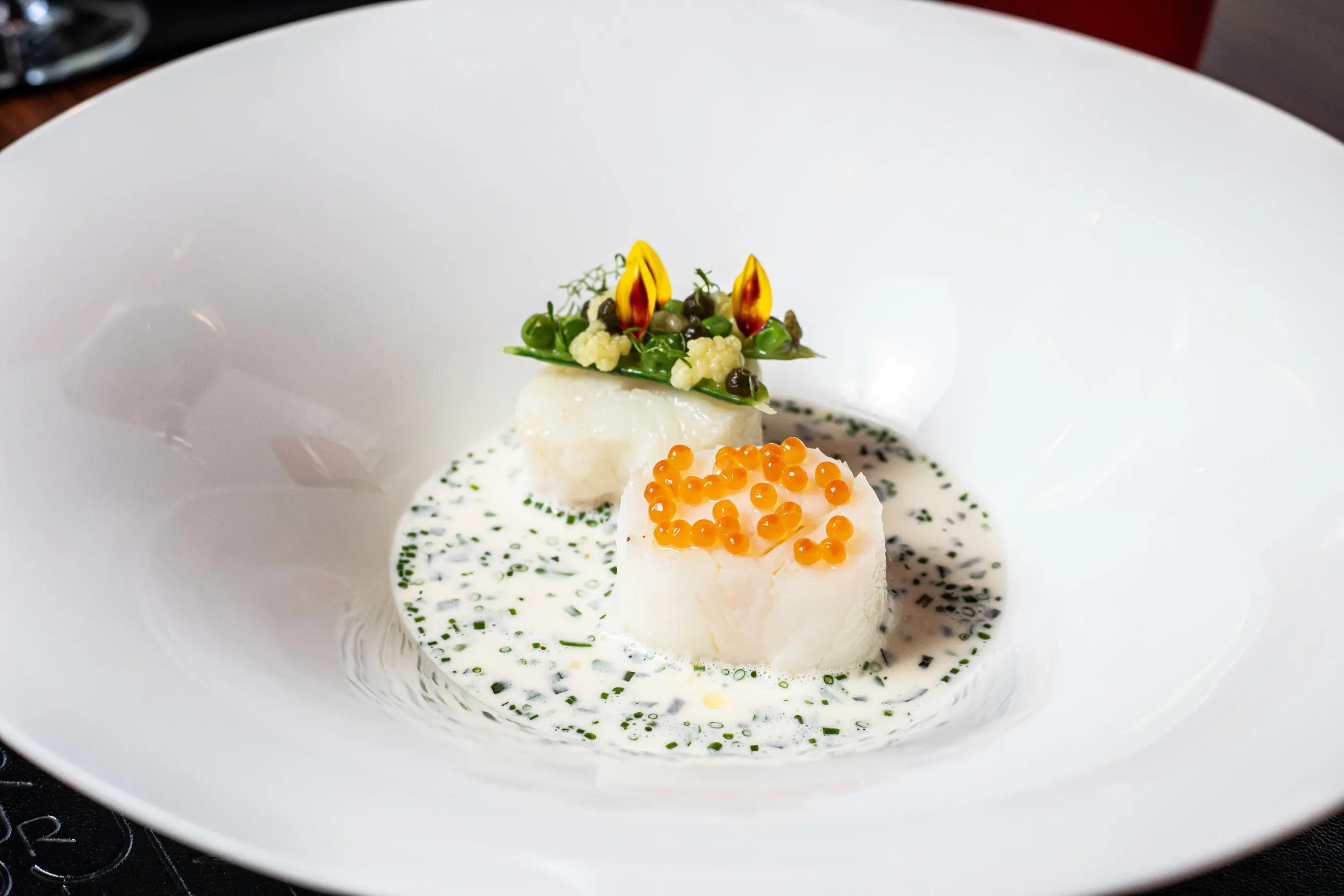 Close-up detail of caviar and refined preparation technique by Executive Chef Friedberg