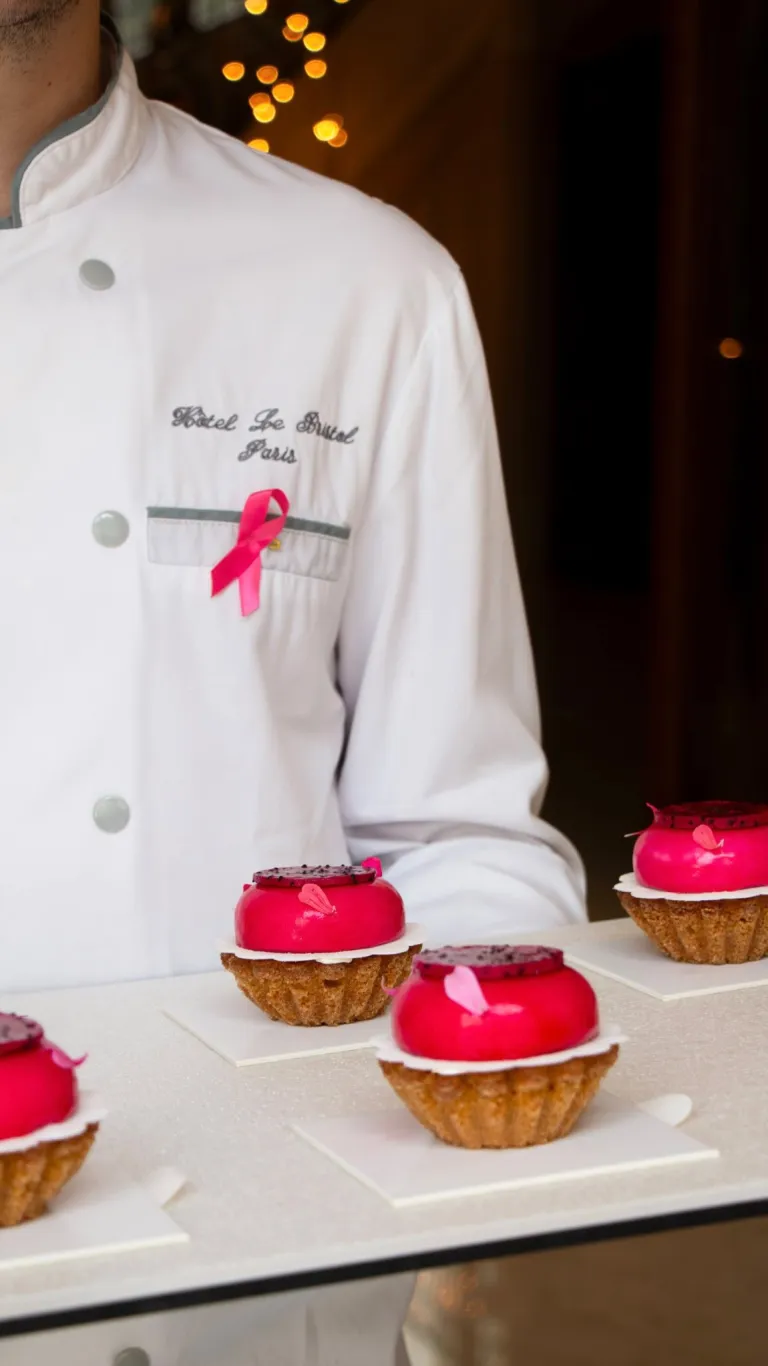 An elegantly presented Dragon Fruit Tart from Le Bristol Paris pastry atelier, showcasing vibrant pink dragon fruit and refined plating characteristic of the hotel's culinary excellence