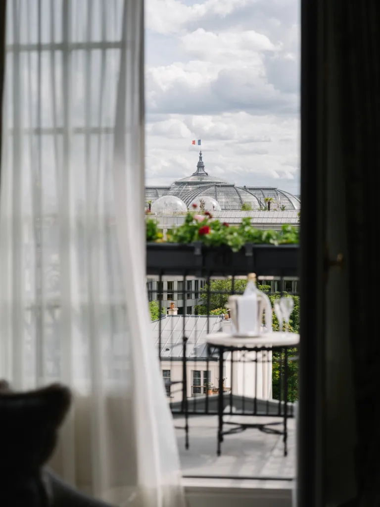 Elegantly appointed bedroom of the Honeymoon Suite at Le Bristol Paris featuring refined furnishings and soft ambient lighting