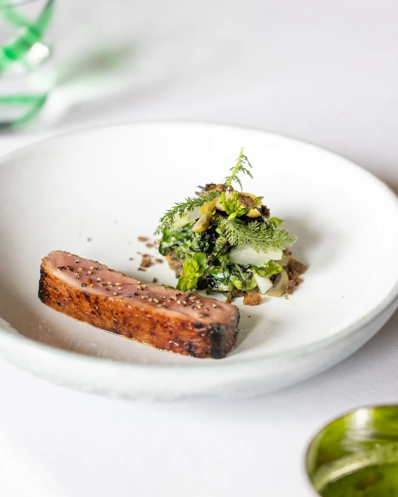Veau grain de soie, a delicately plated veal dish showcasing refined textural contrasts at Le Meurice Alain Ducasse