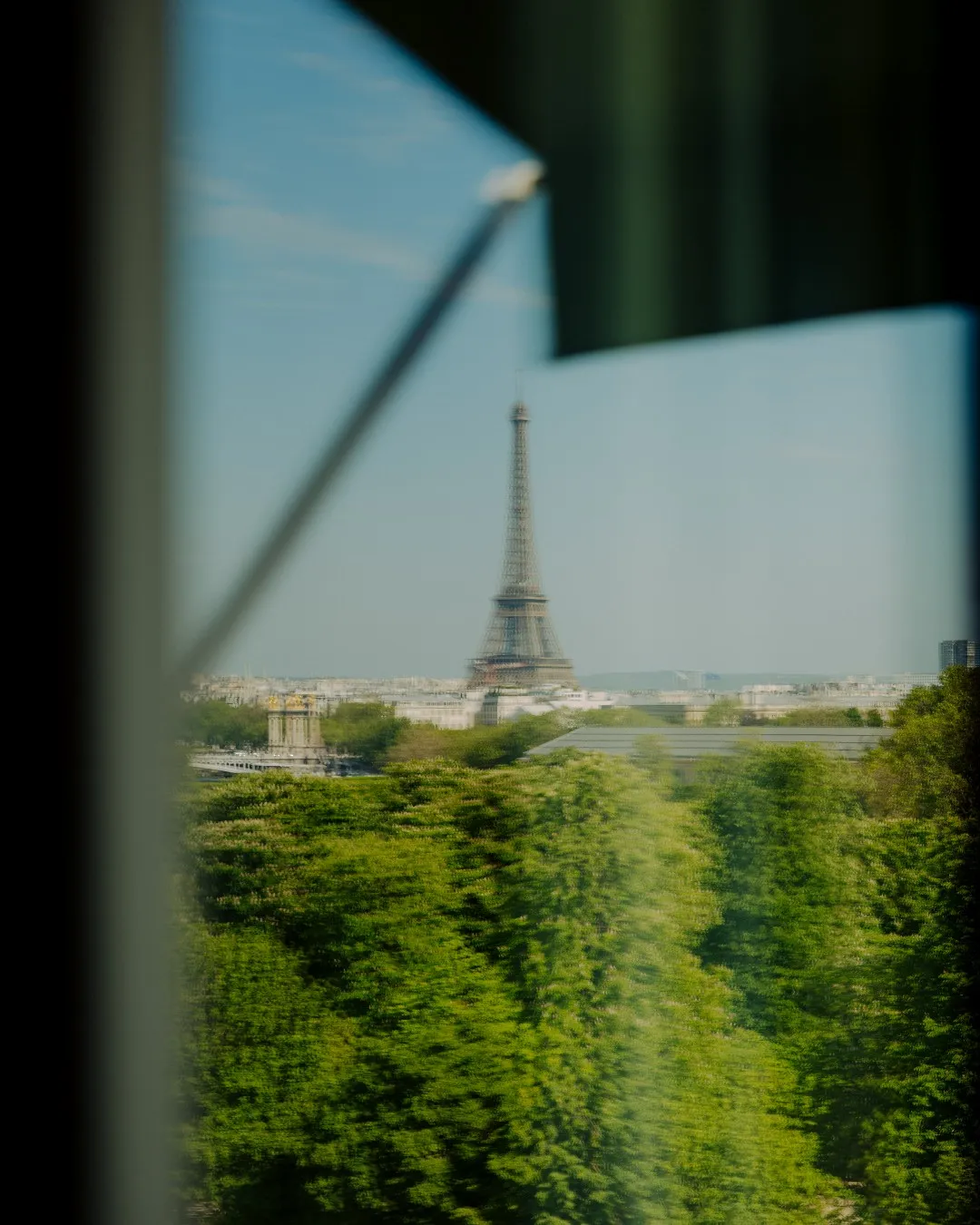 Panoramic view from Le Meurice suite window showing Paris monuments and Eiffel Tower