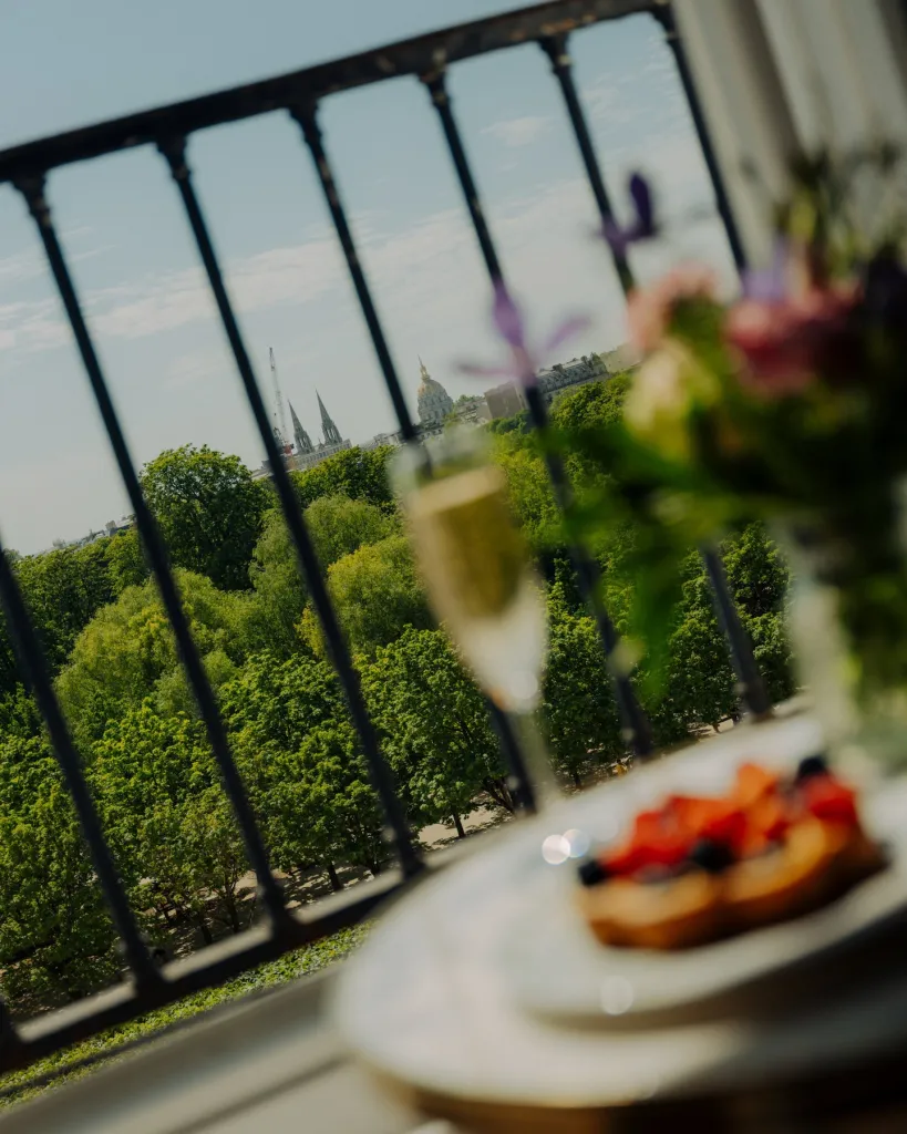 Elegant breakfast presentation in Le Meurice Paris suite with garden and cityscape views