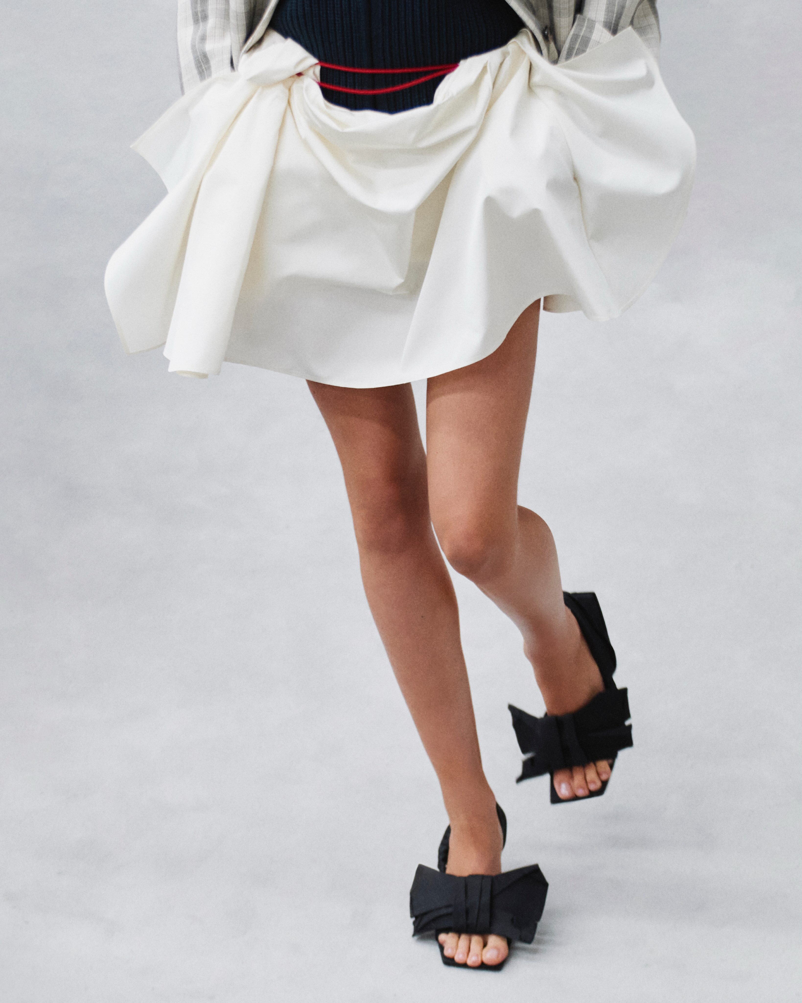Model in complete collection look showcasing the conversation between modernist and baroque elements