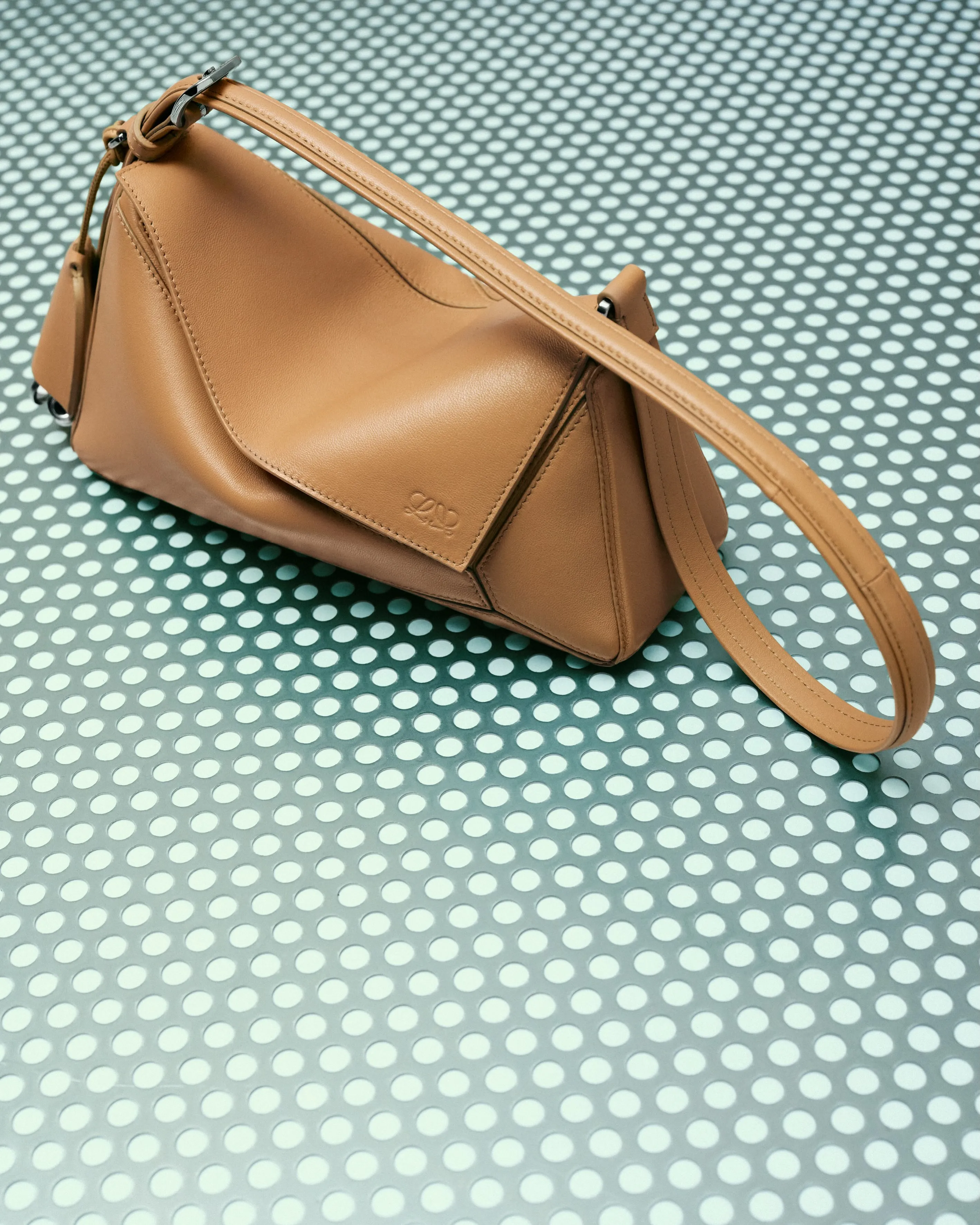 Close-up detail of precisely moulded nappa leather showing supple texture and refined surface finish