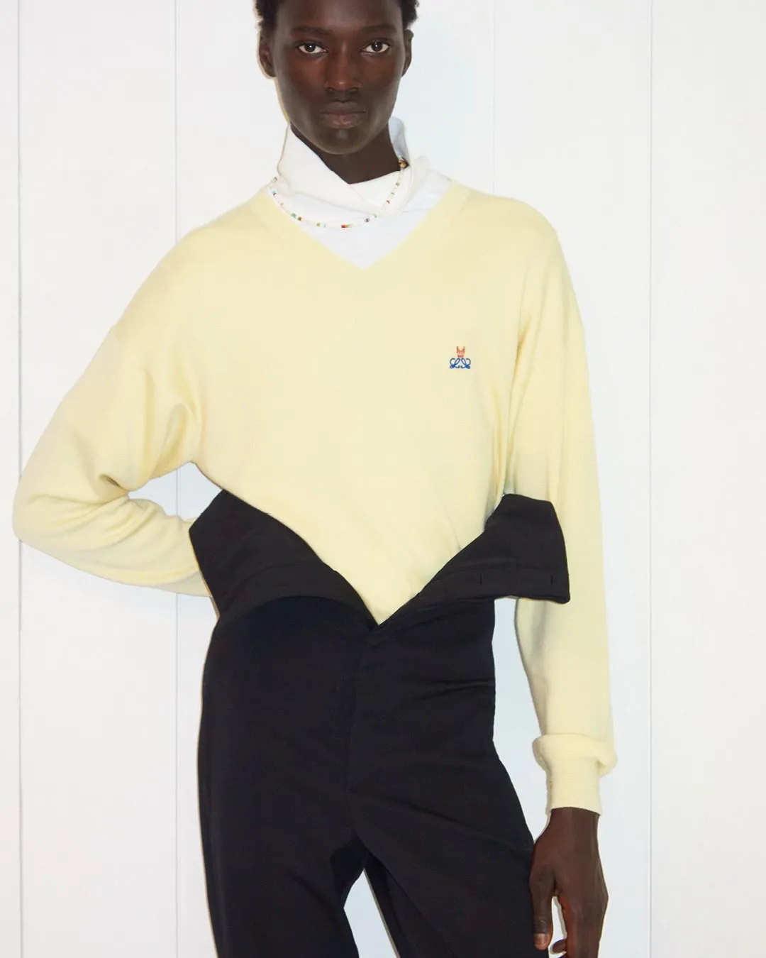 Model wearing sleek moulded nappa dress, demonstrating the garment's fluid, body-conscious silhouette