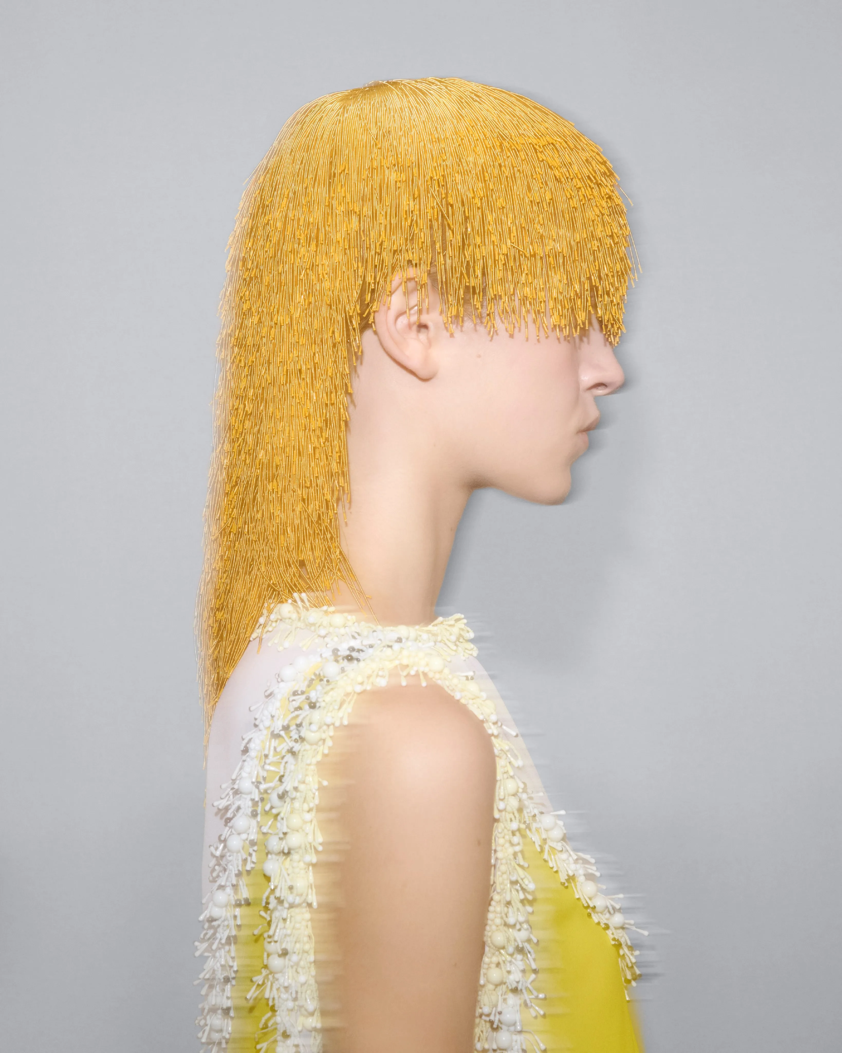 Heel with dense caviar bead clusters creating a fur-like tactile appearance