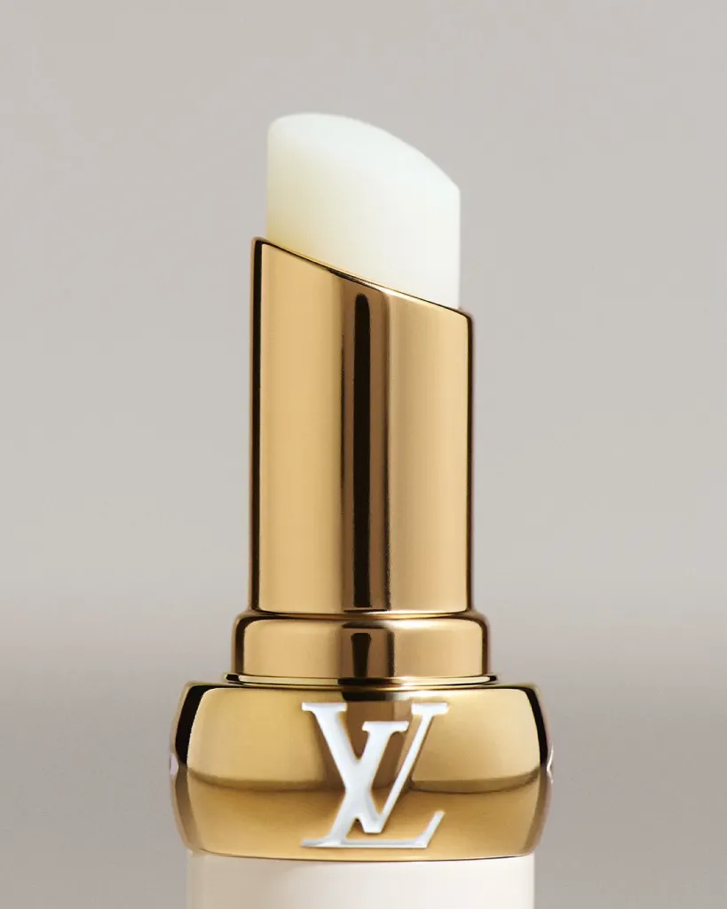 Close detail of LV Baume 000 Infinite Dreamer lip product on model's lips with natural finish