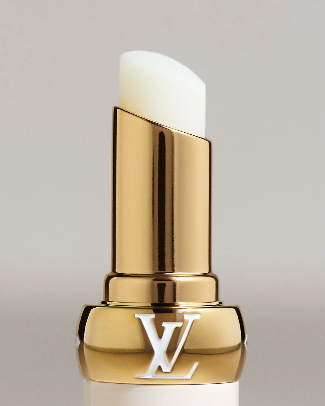 Close detail of LV Baume 000 Infinite Dreamer lip product on model's lips with natural finish