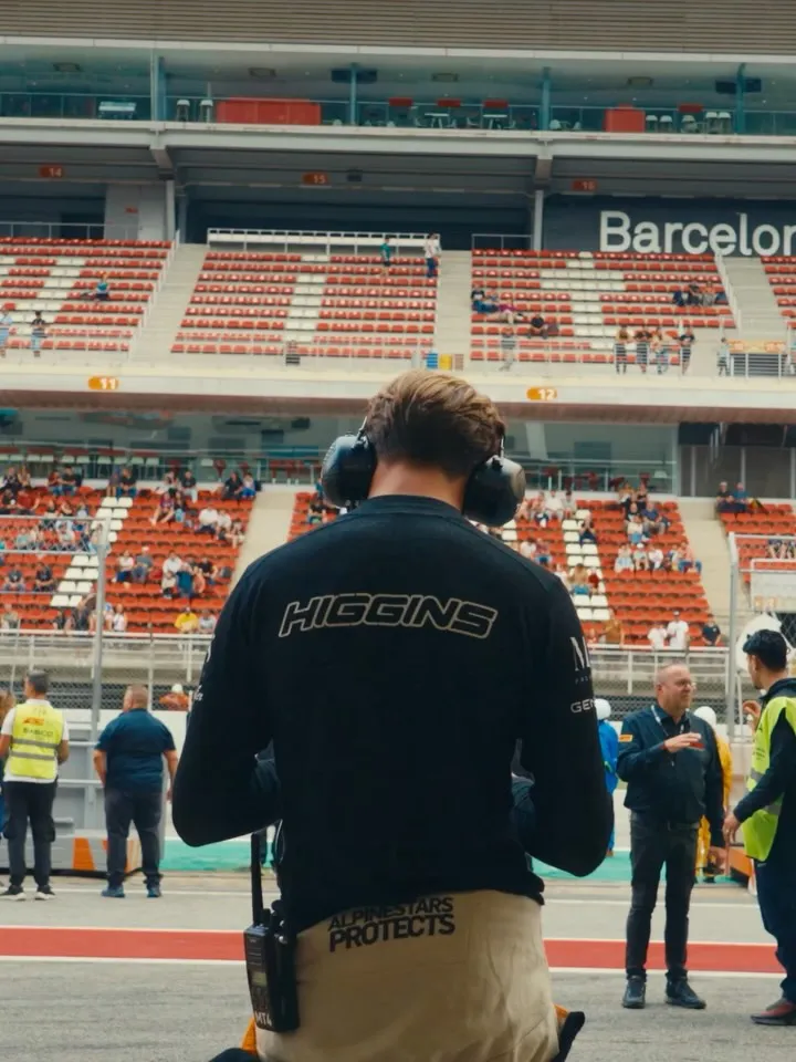 Detailed view of McLaren's aerodynamic bodywork through circuit chicane