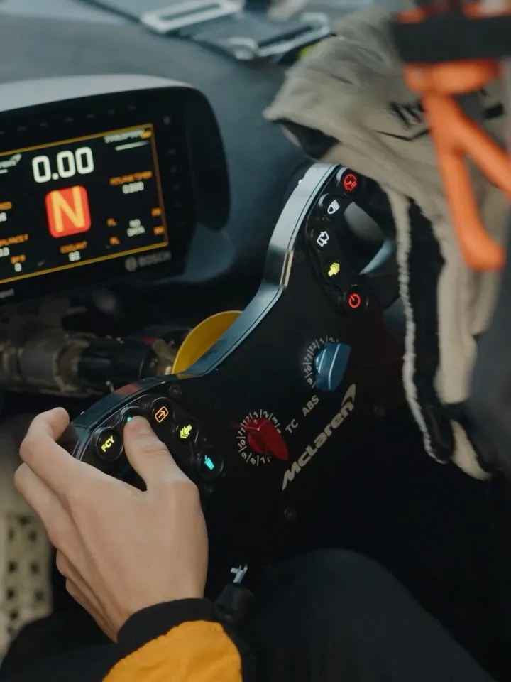 McLaren's distinctive silhouette captured against Mediterranean circuit backdrop