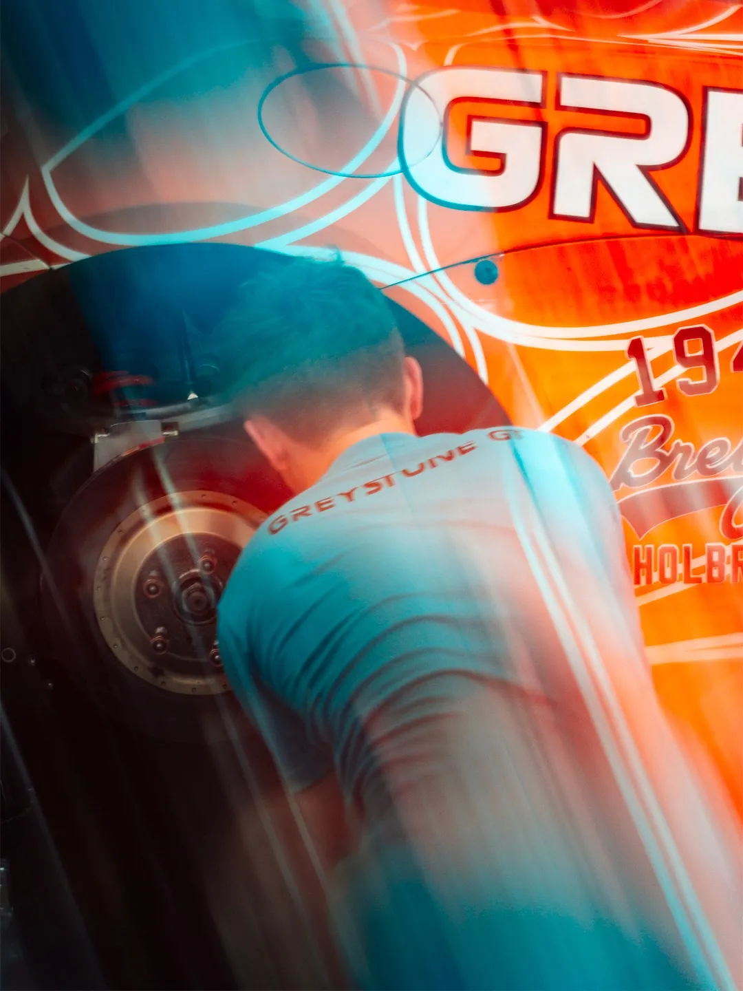 Close-up of McLaren's advanced suspension geometry under dynamic cornering load