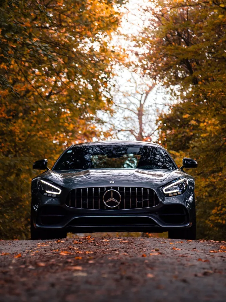 Detailed shot of Mercedes-AMG front grille and headlight signature lighting design