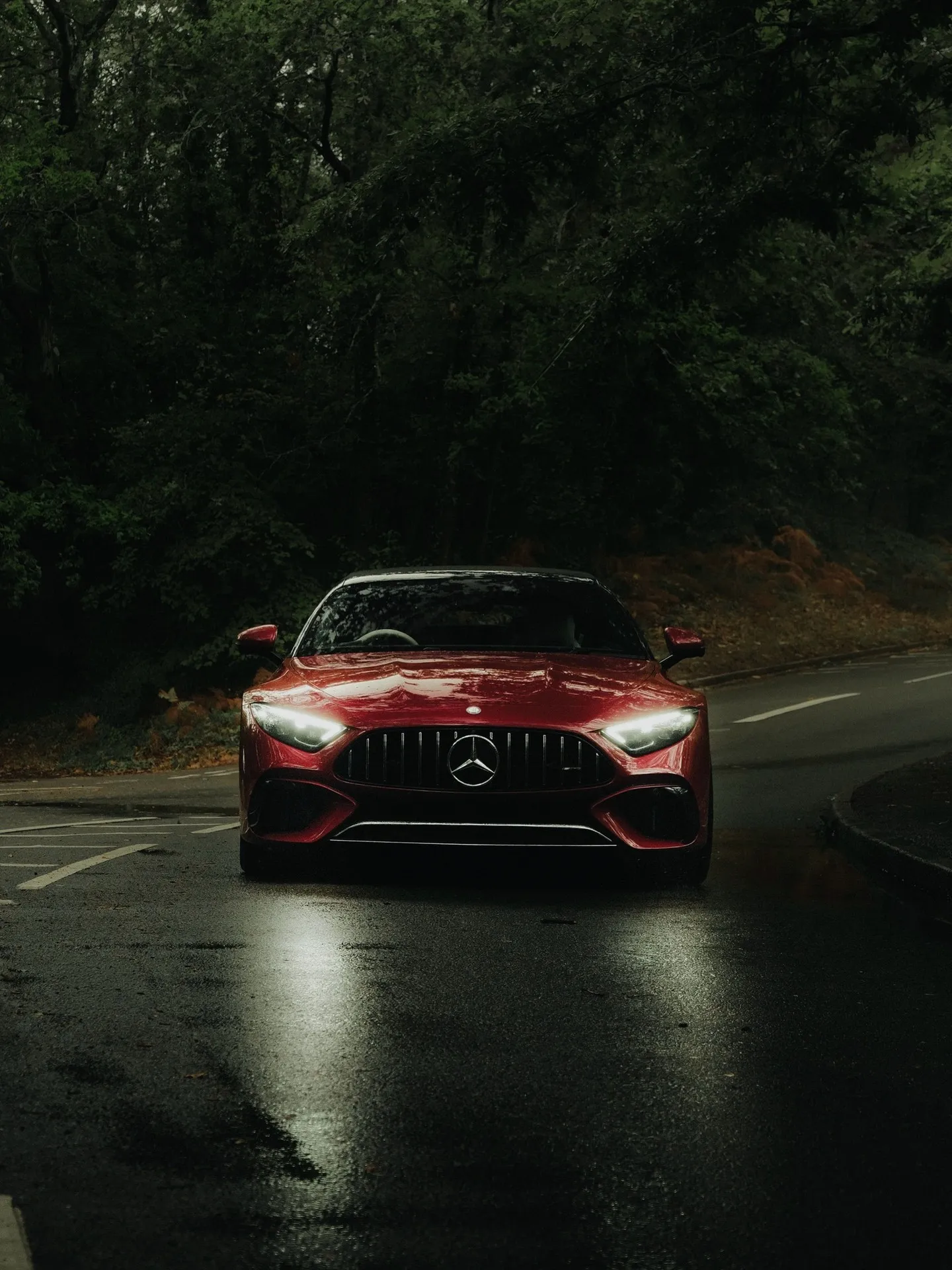 Mercedes-AMG SL 55 4MATIC+ with roof down on scenic autumn road