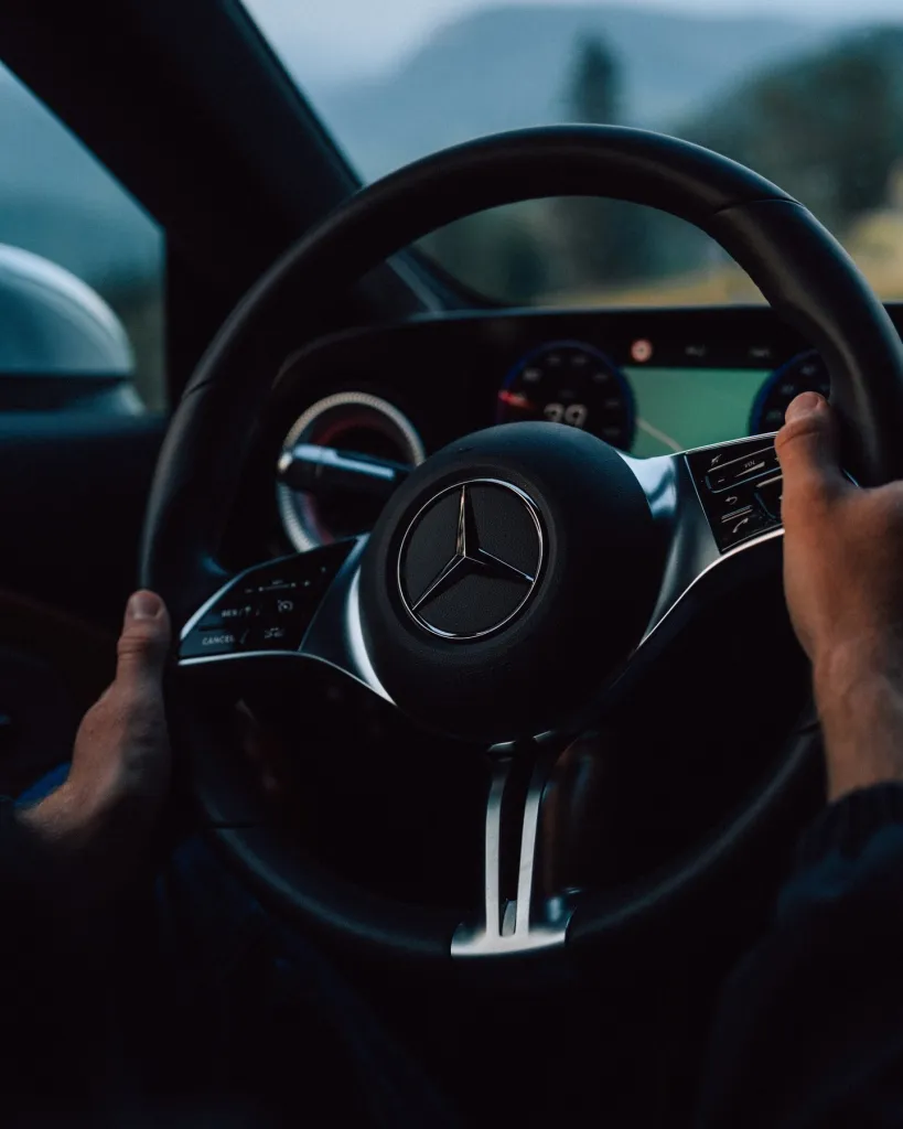 Close detail of the CLA's refined front end design captured in warm sunset lighting