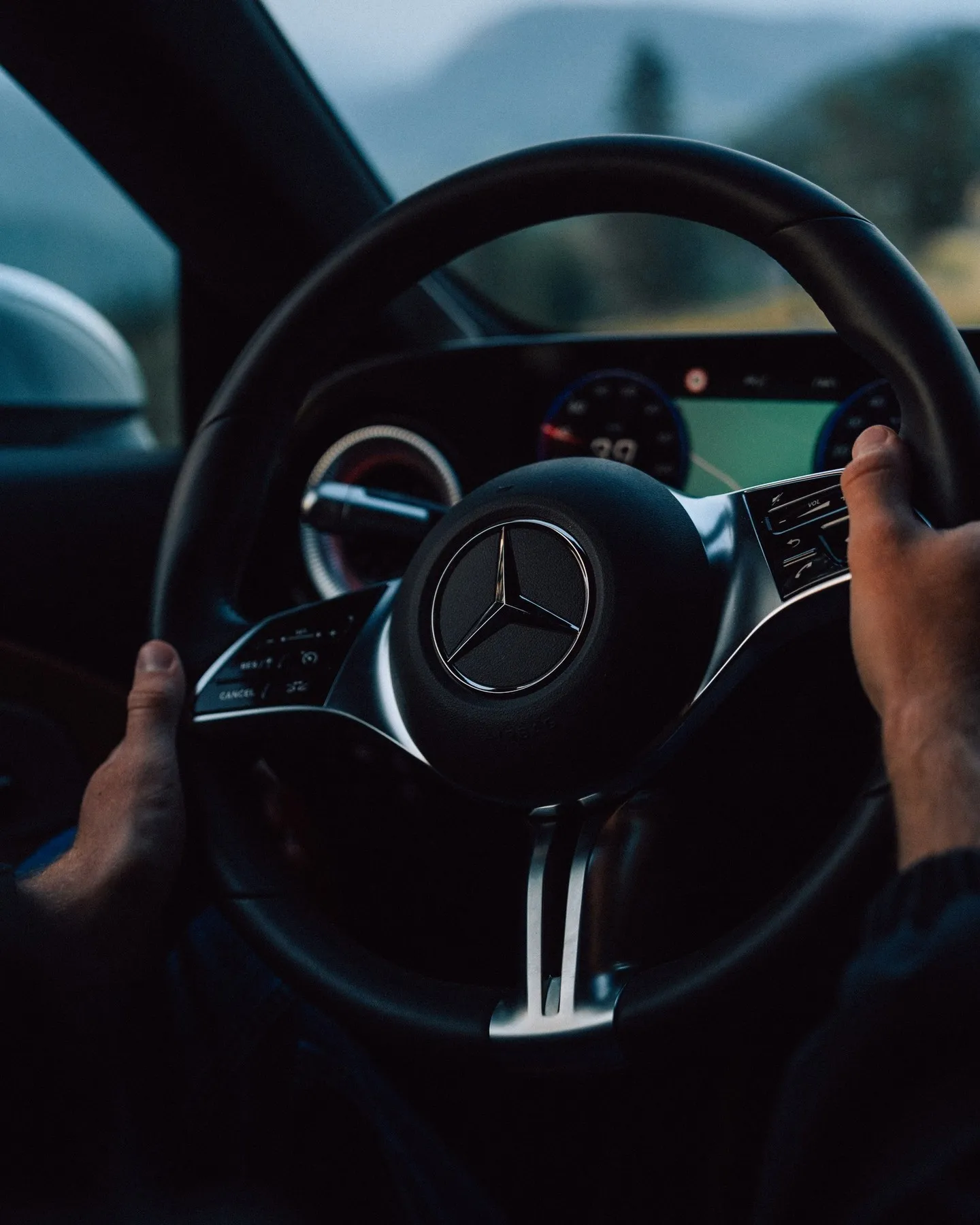 Close detail of the CLA's refined front end design captured in warm sunset lighting