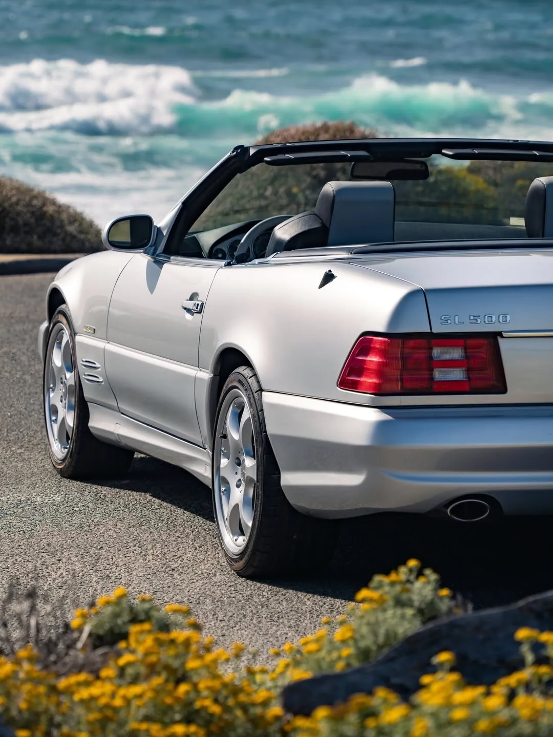 Side profile of the classic Mercedes-Benz SL 500 showcasing its refined proportions and chrome details