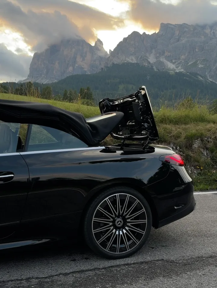 Interior cabin detail of the CLE Cabriolet with mountain scenery framed through open-air environment