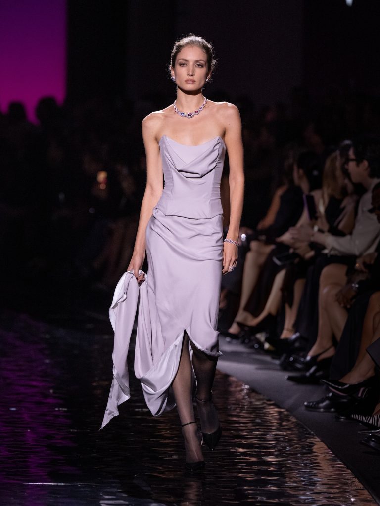 Runway presentation of Messika High Jewelry 2026 Terres de Contrastes collection with dramatic chromatic lighting