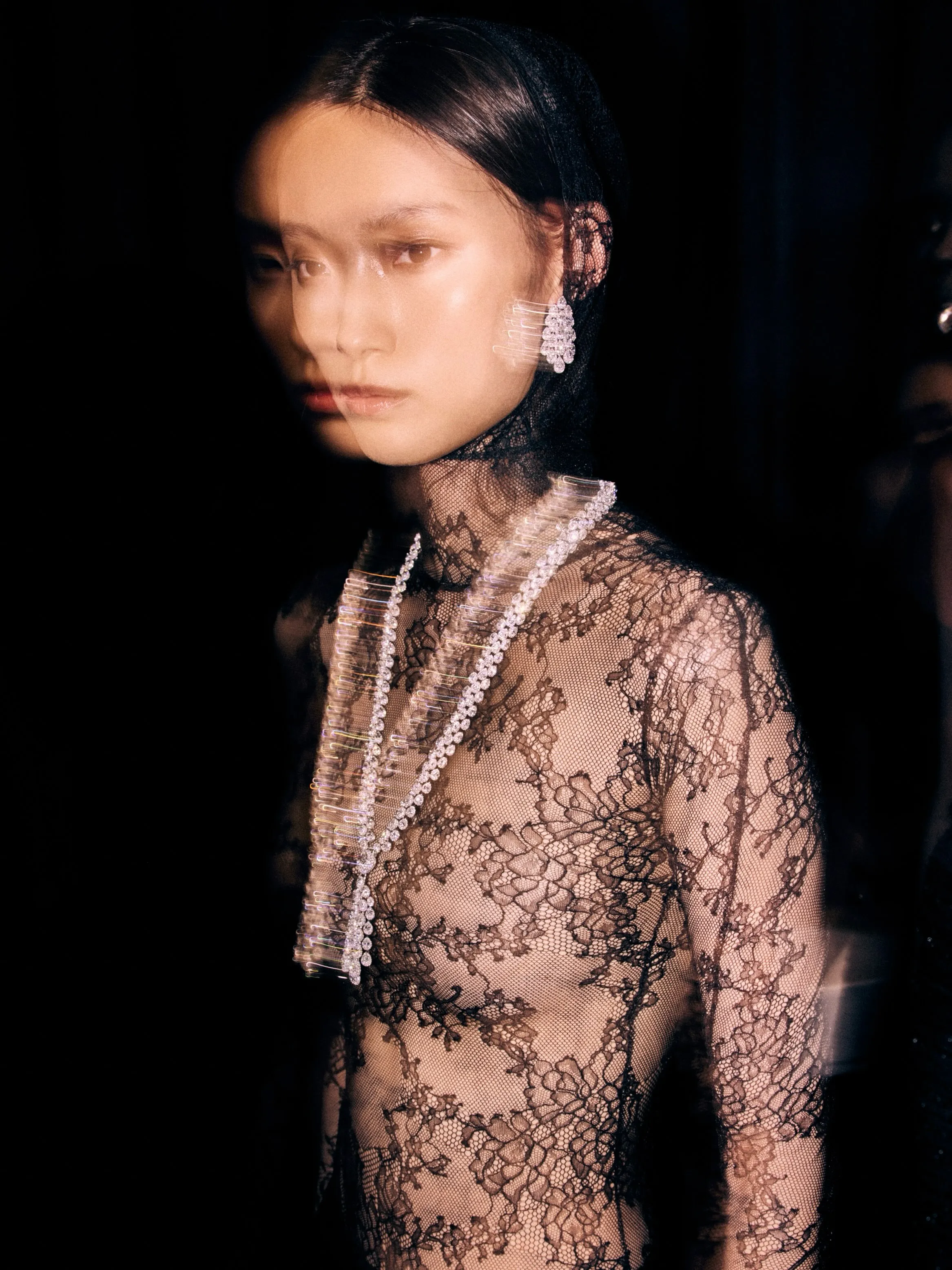 Valérie Messika engages with her models in an intimate backstage moment before the presentation