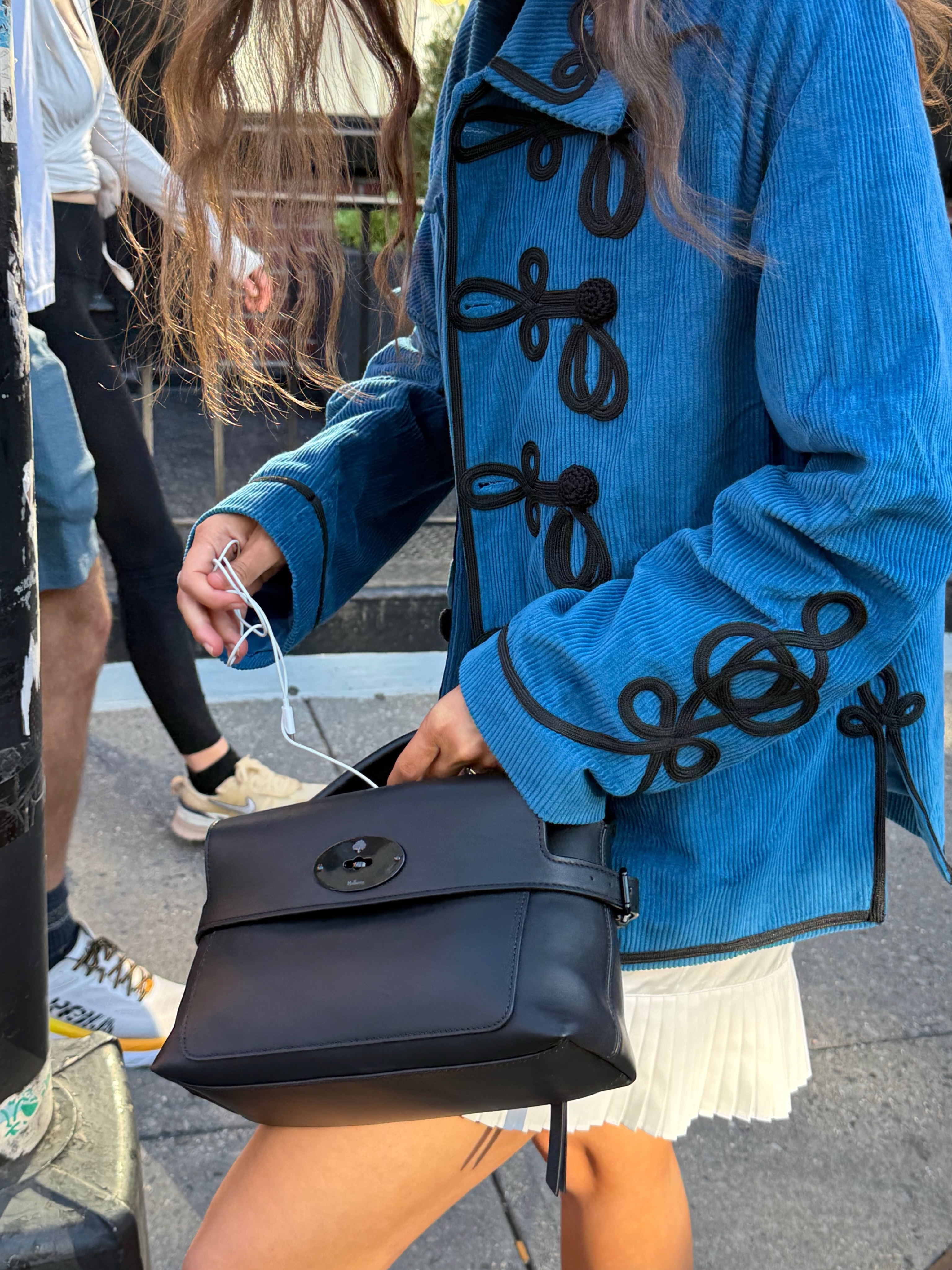 Small Stevie Top Handle bag in classic Black leather with structured silhouette and top handle detail