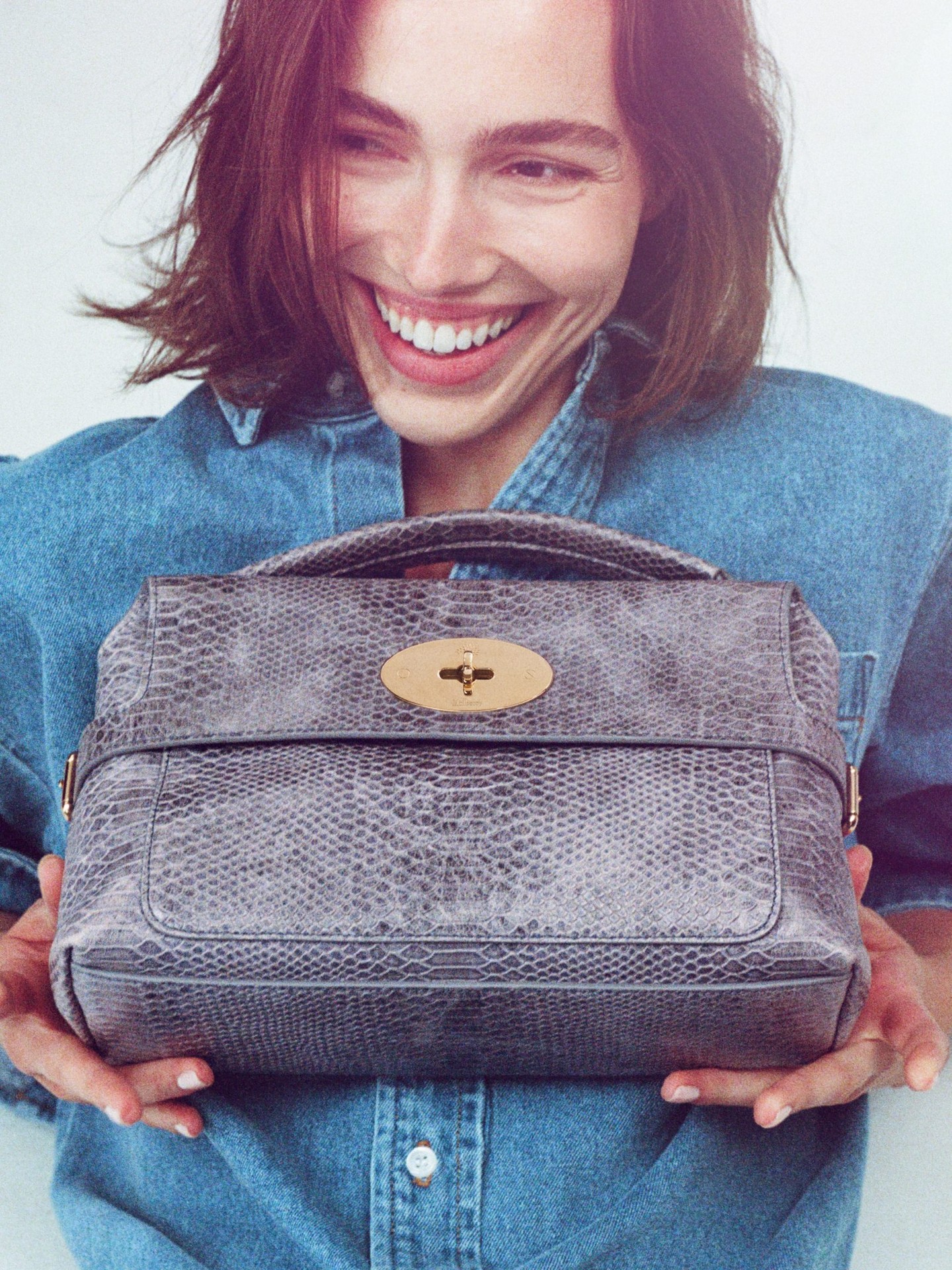 Detailed view of the bag's architecture, highlighting texture and material composition in luxurious finish