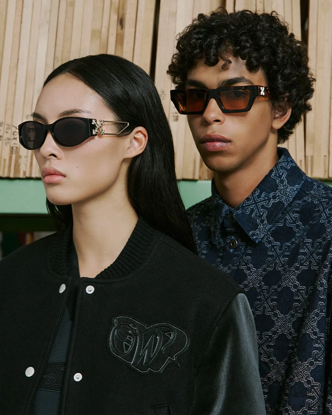 Models Josefin and Timoteo showcase Off-White's Lights of Youth collection during Milan presentation, featuring contemporary tailoring and luminous design aesthetic