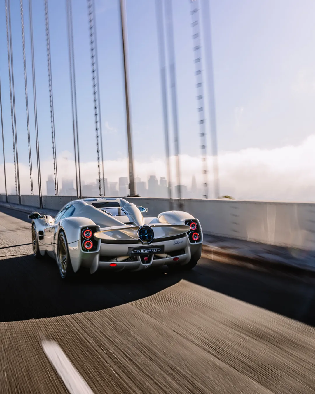 Pagani Utopia Coupé bathed in San Francisco sunlight, showcasing elegant aerodynamic profile and sinuous body lines