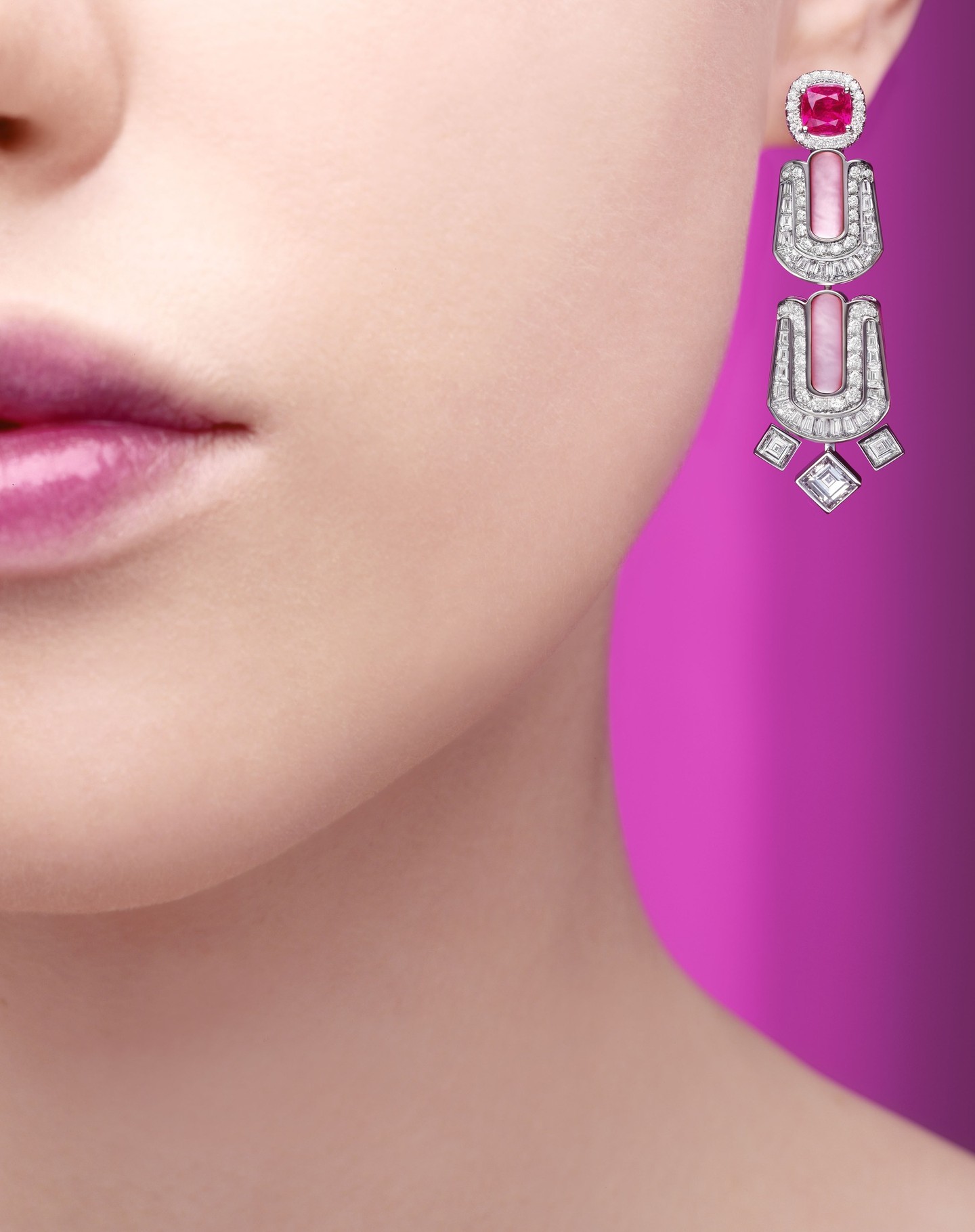Piaget high jewellery featuring vibrant pink sapphires framed by diamonds in an ornate precious metal setting