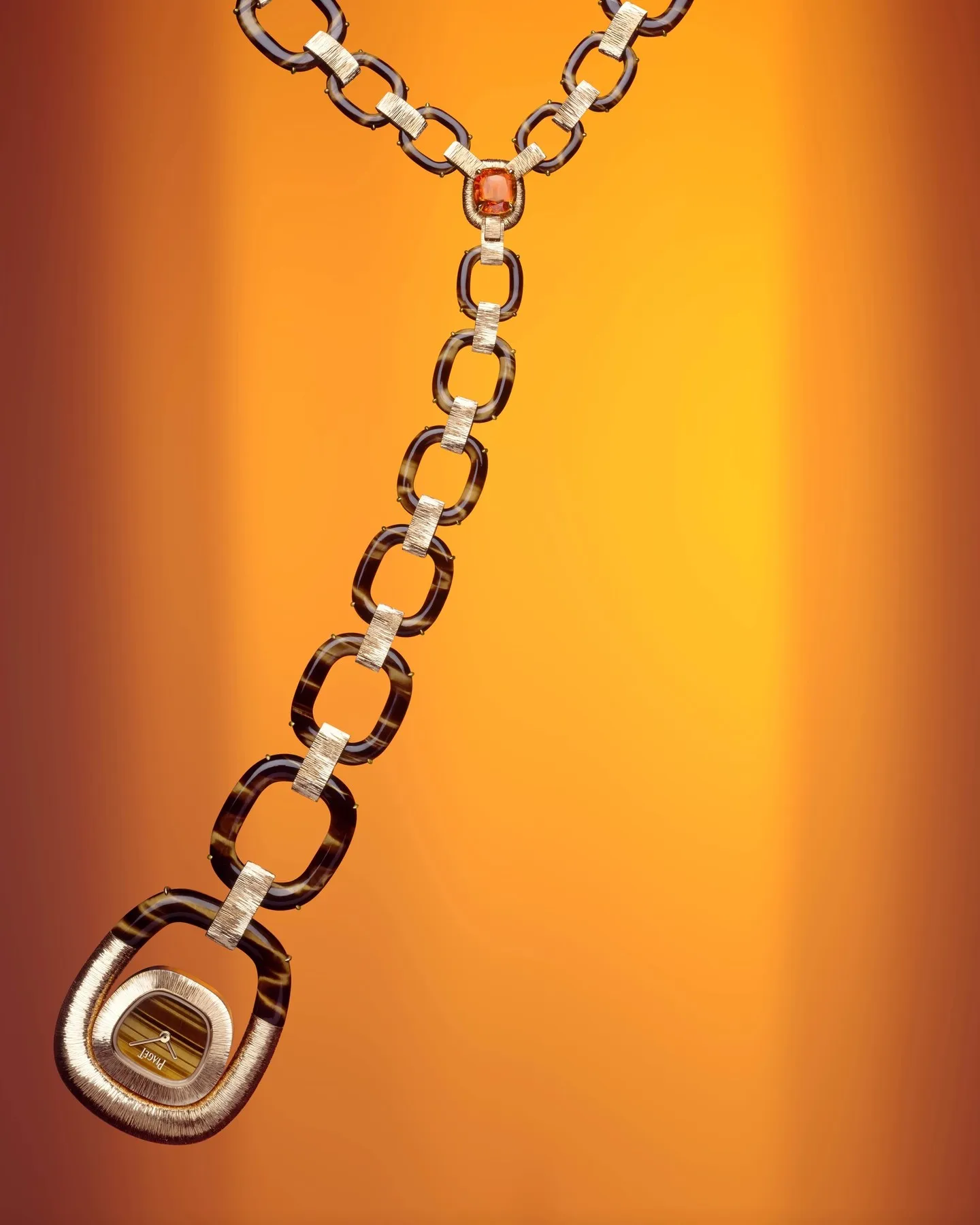 Piaget Flamboyant Links sautoir watch in sculpted rose gold with richly veined tiger's eye stone detail