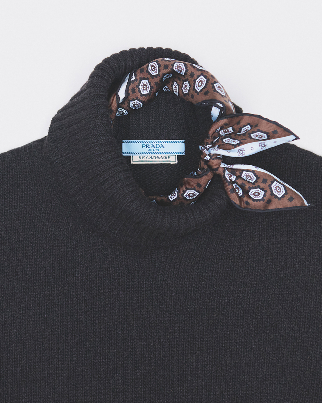 A complete autumn-winter 2026 ensemble in Re-Cashmere and Re-Wool, demonstrating the refined aesthetic and enduring luxury of Prada's responsibly sourced collection