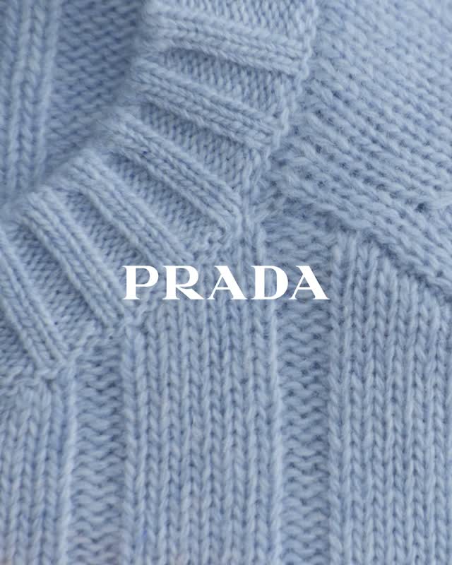 Carefully folded wool garment showcasing the refined texture of Prada's Re-Wool collection