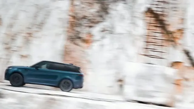 Range Rover Sport Electric demonstrating all-terrain capability across dramatic alpine landscape