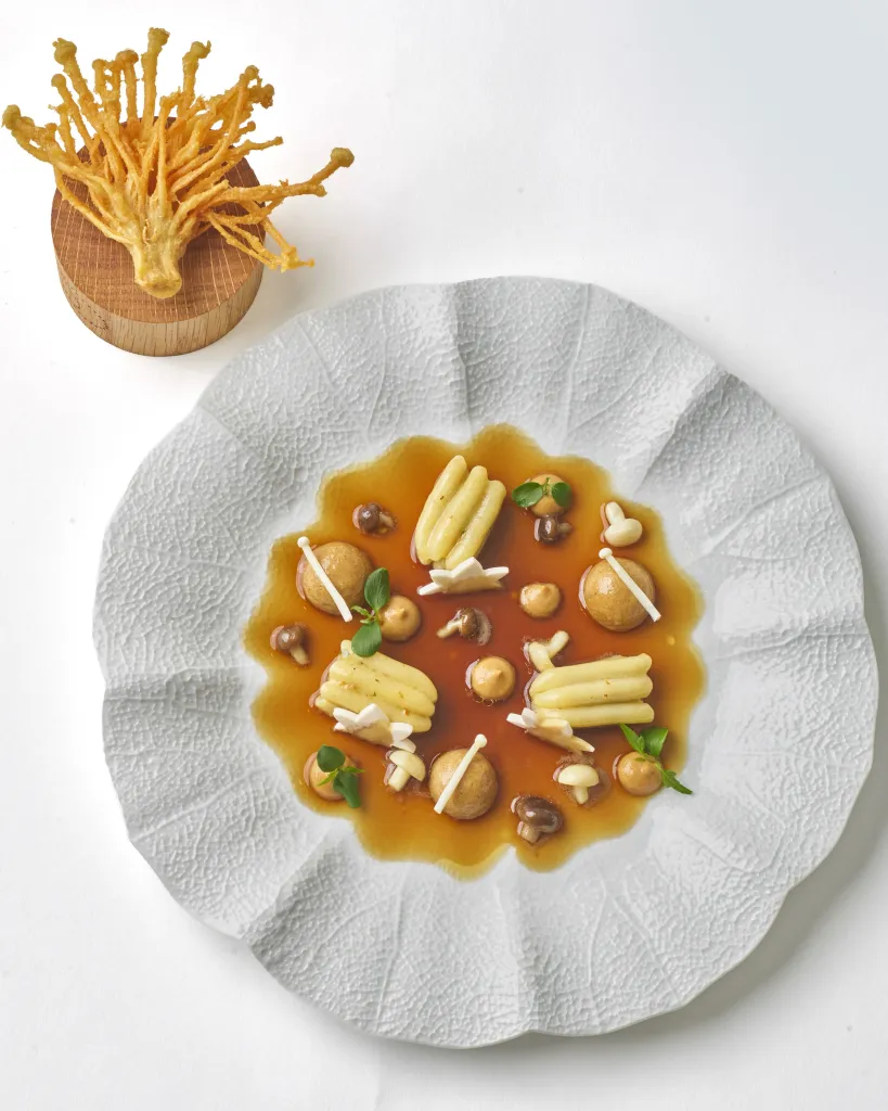 Close detail of autumn-inspired seasonal dish presentation at Restaurant Daniel featuring precisely composed ingredients