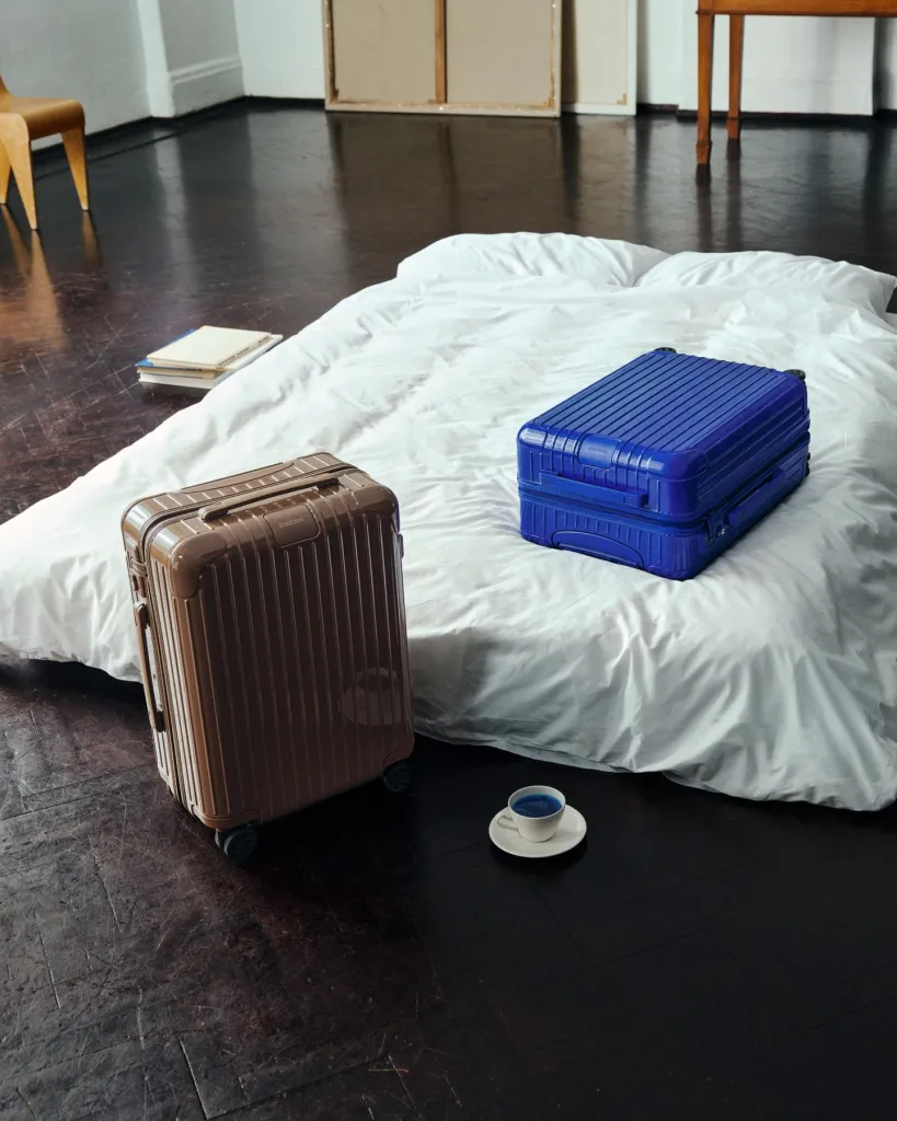 Close detail of Ultramarine Rimowa luggage demonstrating precision engineering and distinctive ribbed texture