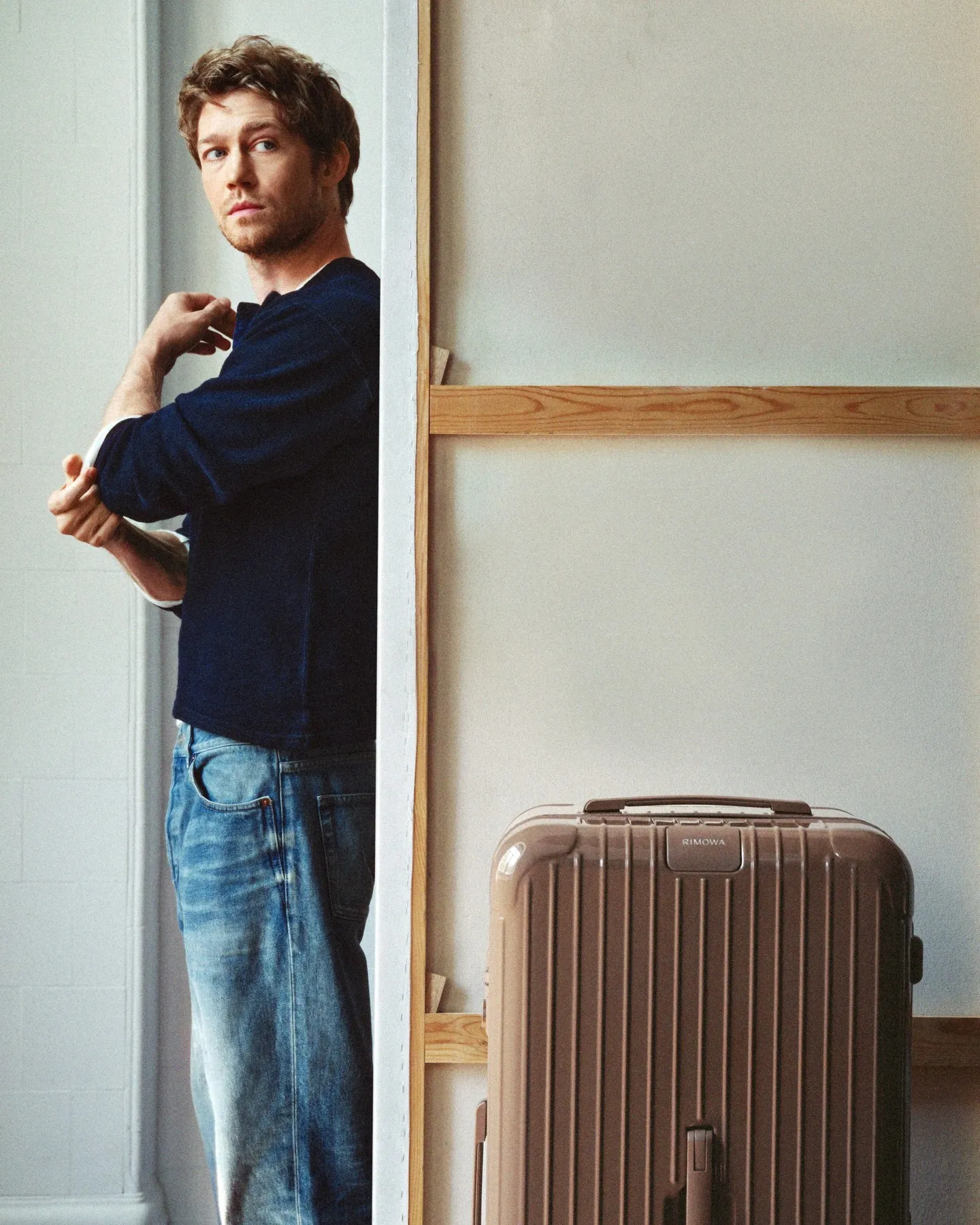 Rimowa Umber limited edition suitcase in warm earthy brown tone, photographed against neutral backdrop