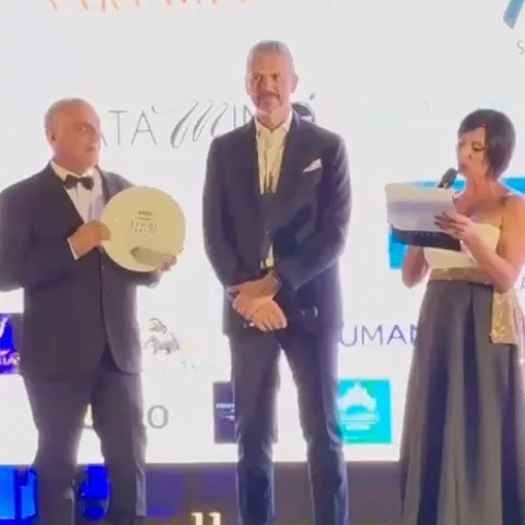 Chef Andrea Berton receiving recognition for his distinguished contributions to Italian culinary heritage and excellence