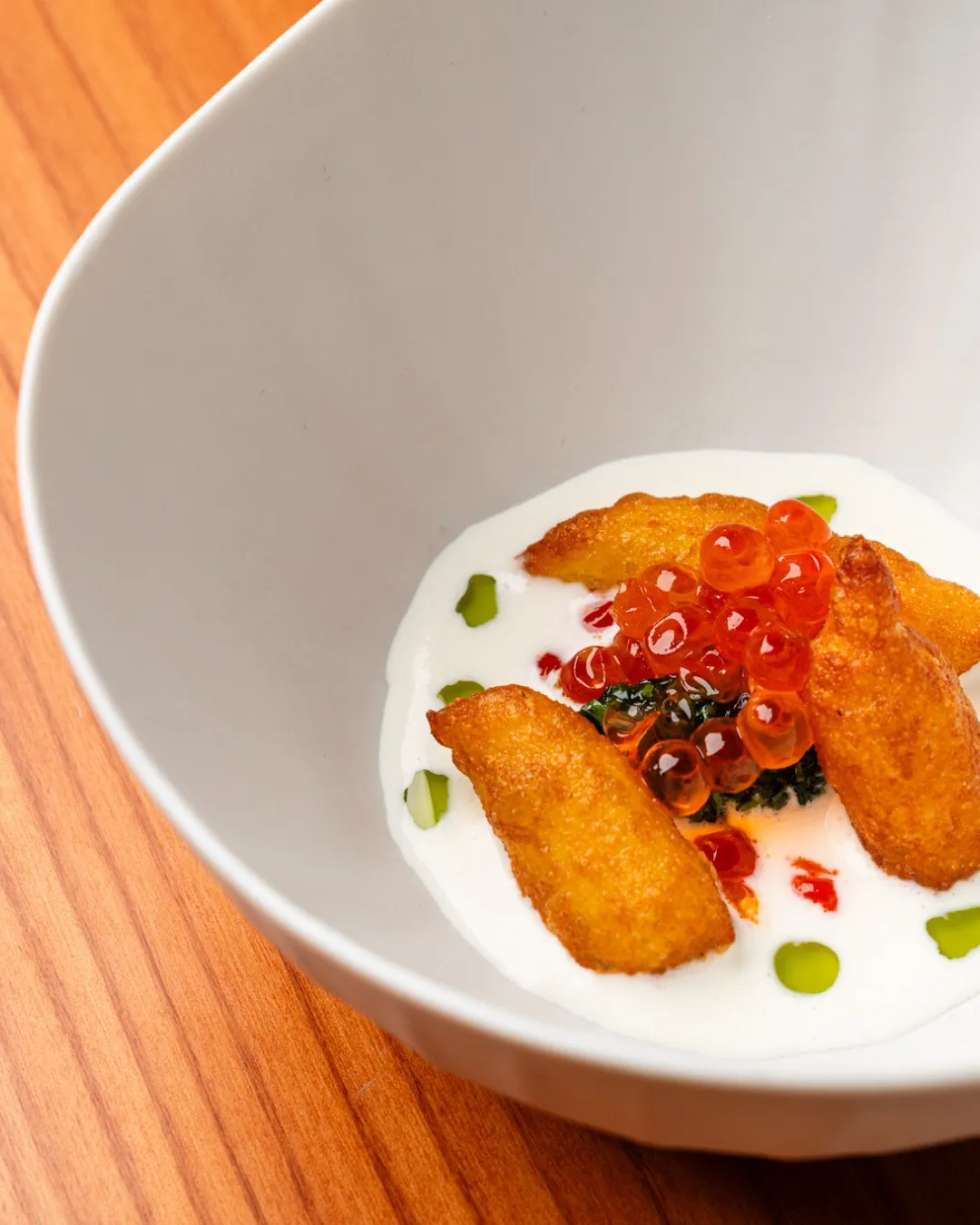 An elegantly plated course from the Circus Menu showcasing Chef Anthony Genovese's refined approach to seasonal seafood preparation