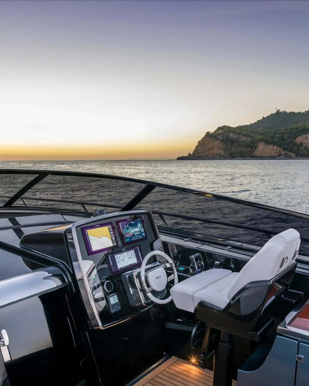 Interior view of the Riva 56' Rivale helm station, featuring advanced navigation technology and refined luxury appointments