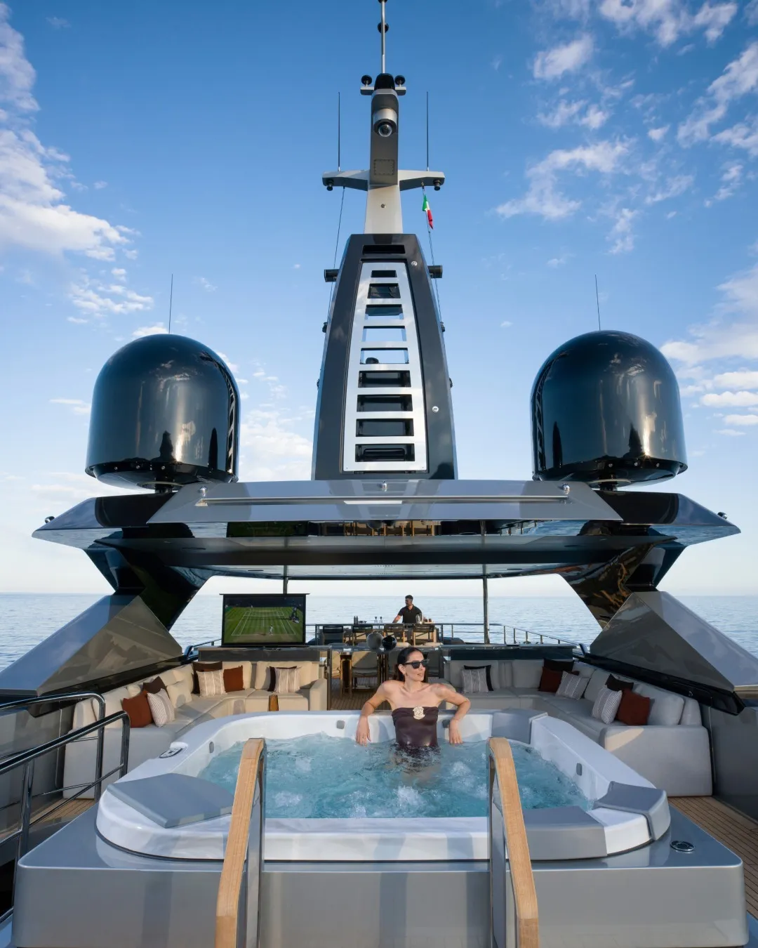 The Riva 54Metri superyacht's luxurious white ceramic pool surrounded by generous sunpads overlooking the Mediterranean Sea