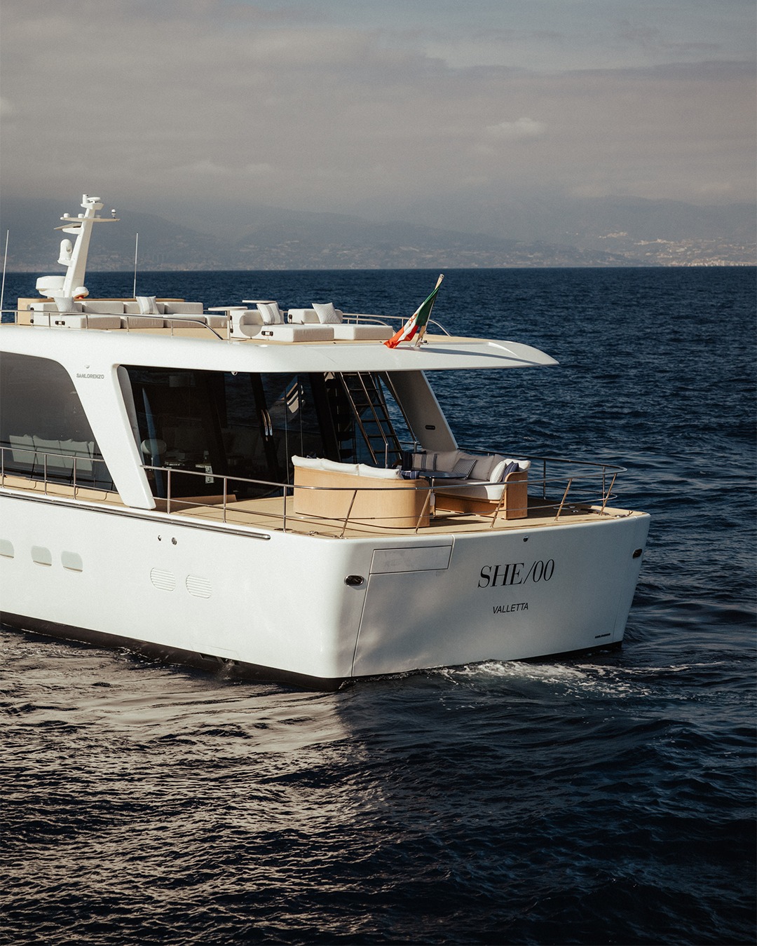Sanlorenzo vessel docked in historic Genoa, embodying luxury seaside living