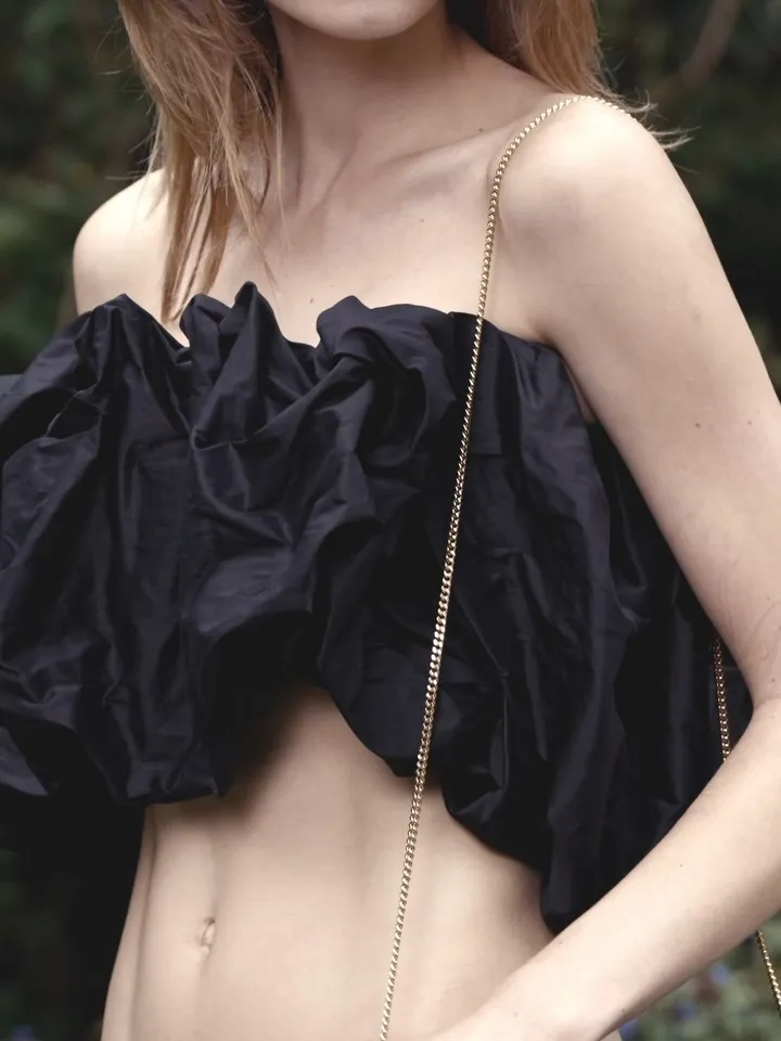 Close detail of the new heart-shaped bag in cruelty-free vegan leather with refined hardware