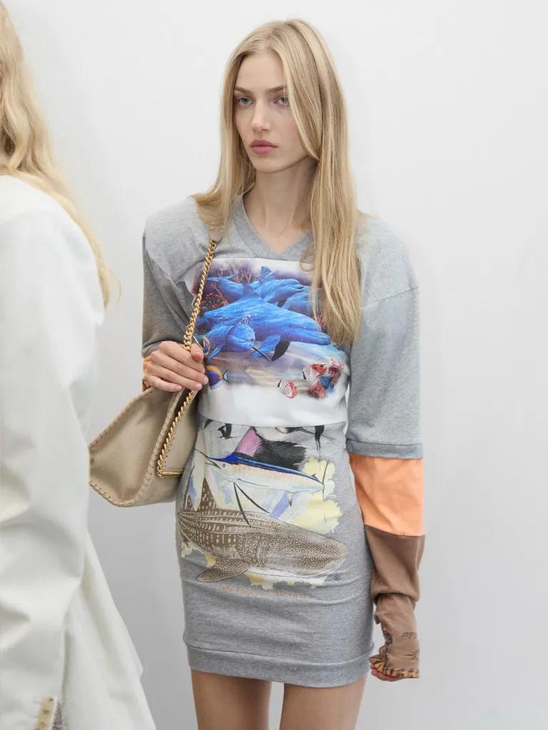 Model wearing McCartney tailored piece styled with Ryder bag in recycled TPU