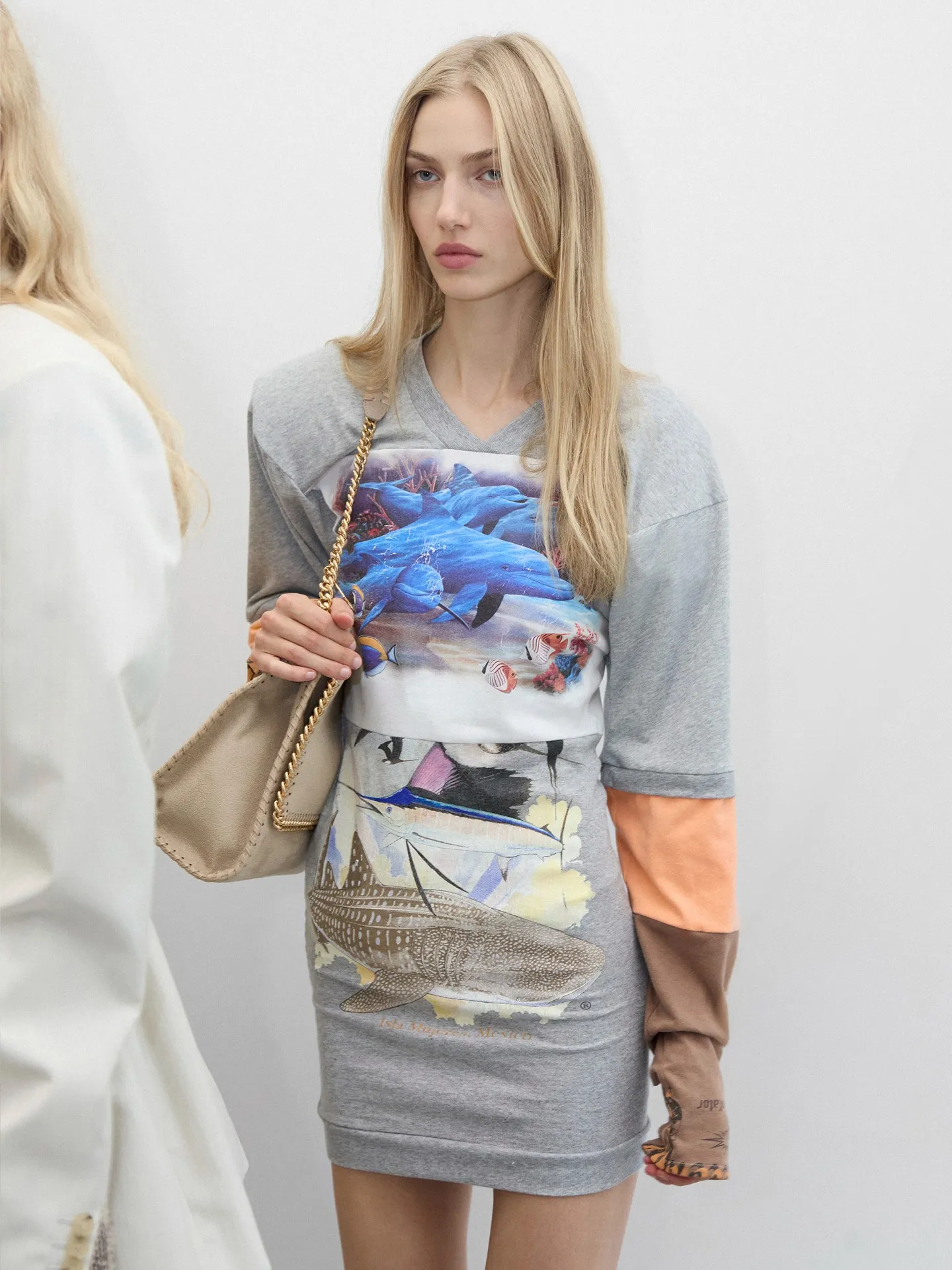 Model wearing McCartney tailored piece styled with Ryder bag in recycled TPU