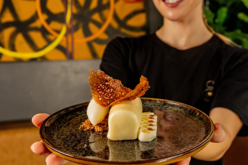 Close detail of the yuzu pear gel and Ford's Farm bayrum and ginger sorbet on the finished dessert