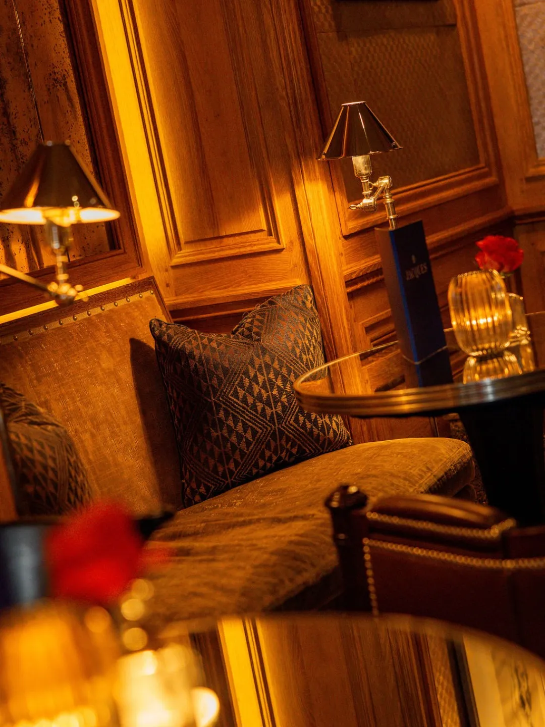 Jacques Bar at The Lowell Hotel, featuring artfully crafted Martinis on the bar counter with warm ambient lighting and sophisticated interior design