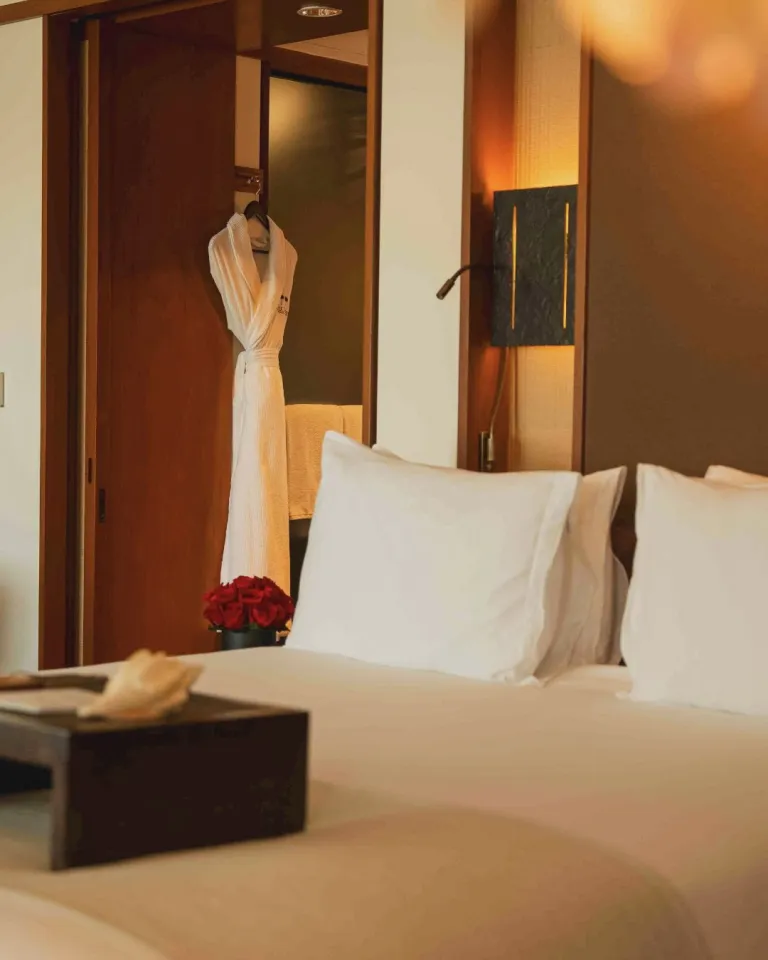 Elegant Art Deco Suite at The Setai Miami Beach featuring warm teak panelling and natural textures