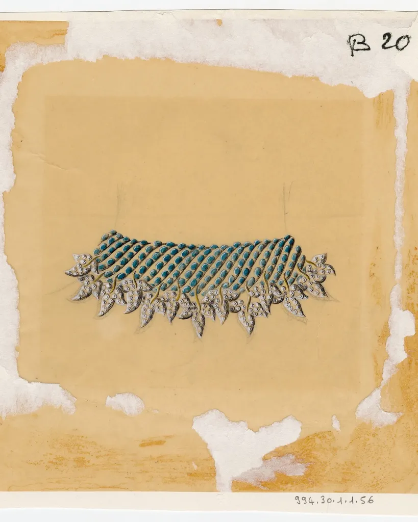 Close-up detail of a Schlumberger jewellery piece displaying intricate gemstone work and sculptural form