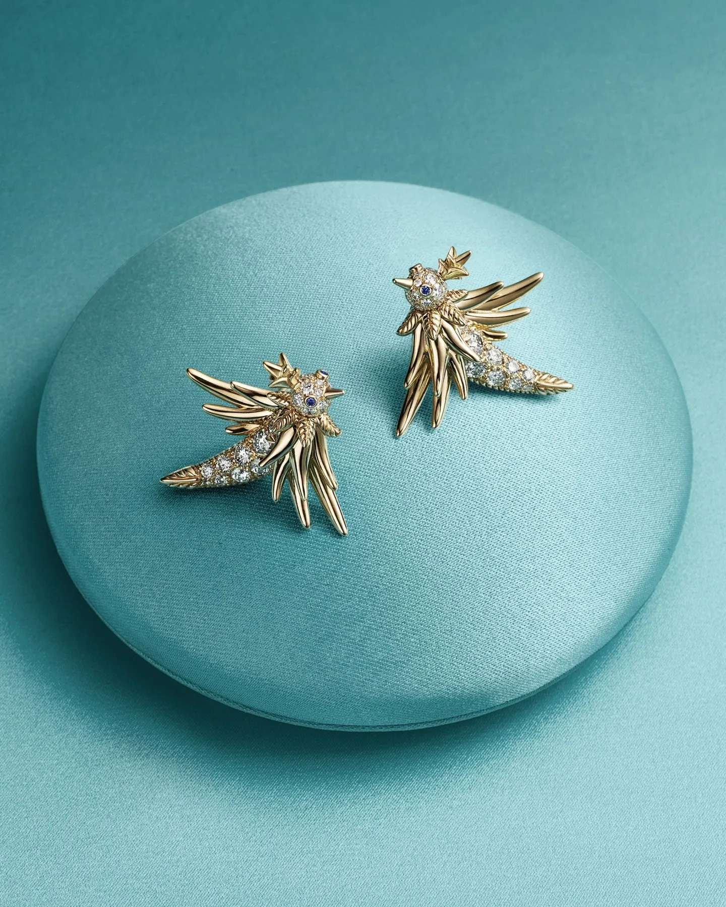Tiffany & Co. Bird on a Rock partial pavé diamond earrings in 18k gold with multi-layered sculpted feather detailing