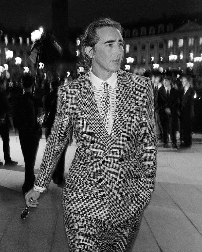 Attendee in elegant attire arriving at Tom Ford Spring Summer 2027