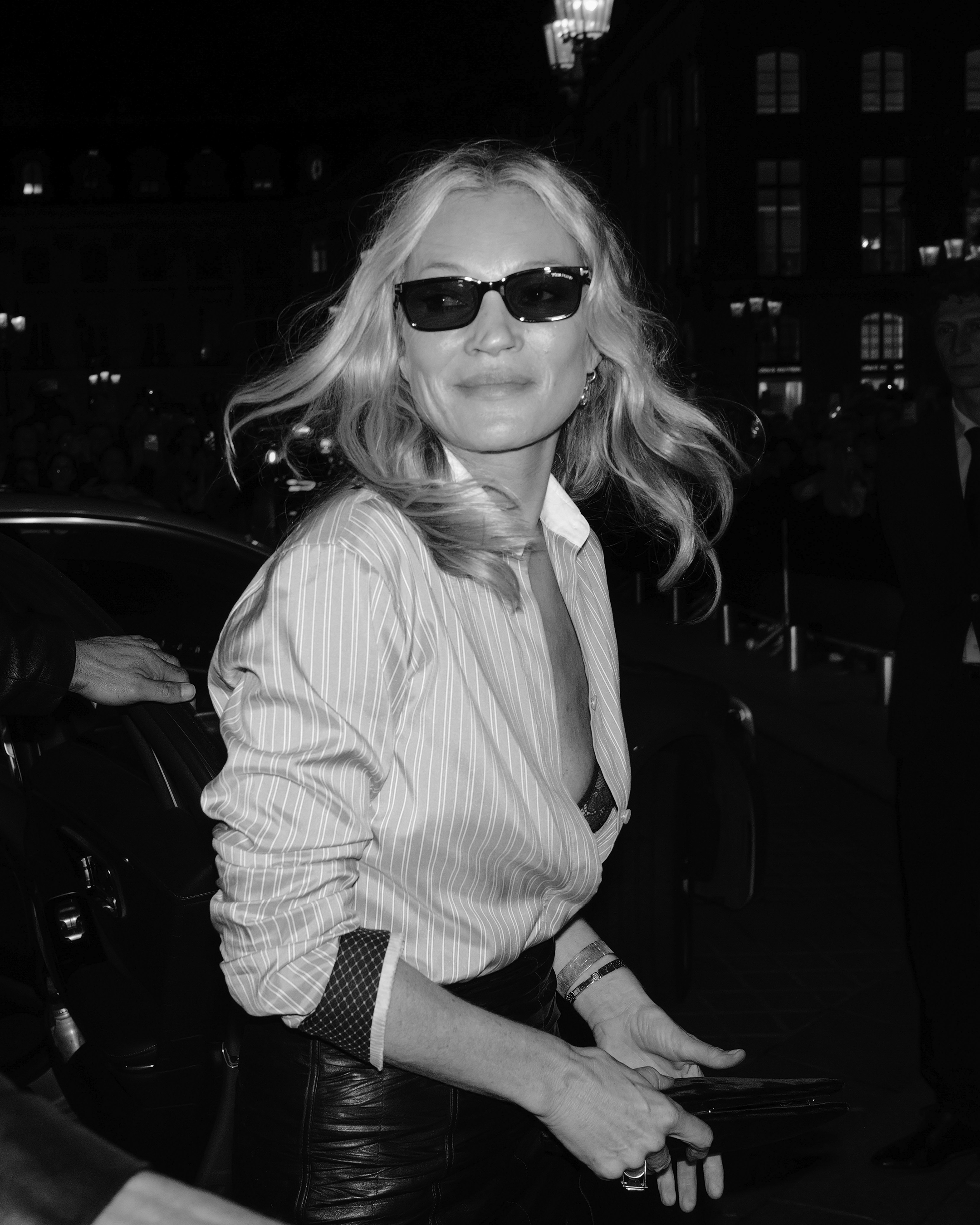 Attendee in luxurious ensemble at Tom Ford presentation